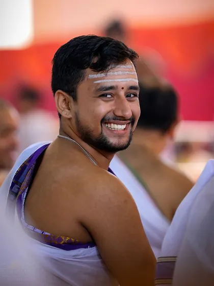The joyful smile of a devotee during the Rishi Homa. The nine days of Navratri are filled with moments of profound peace, happiness, and inner connection.