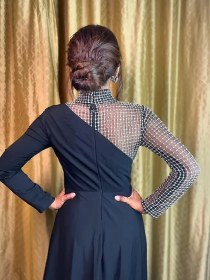 The final look from the back, a perfectly executed bun that's both stylish and secure.