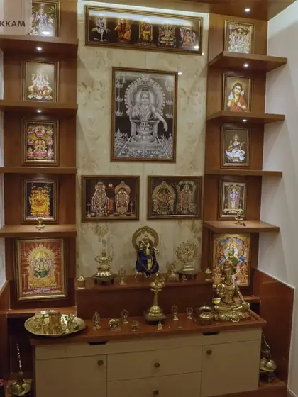 A traditional and serene pooja unit in the Ayyapakkam villa, with multi-level wooden shelves perfect for displaying idols and sacred items.