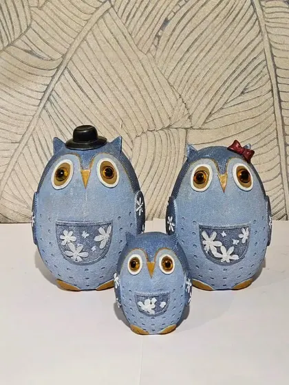 An adorable owl family of three in a denim-blue finish. This set is perfect for representing your own family on a mantelpiece or shelf.