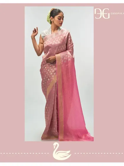 This opulent tissue jacquard saree in 'Ashes of Roses' is a picture of grace. The subtle color is enhanced by the shimmer of the tissue fabric and a contrasting madder rose pallu, designed for the modern bride.