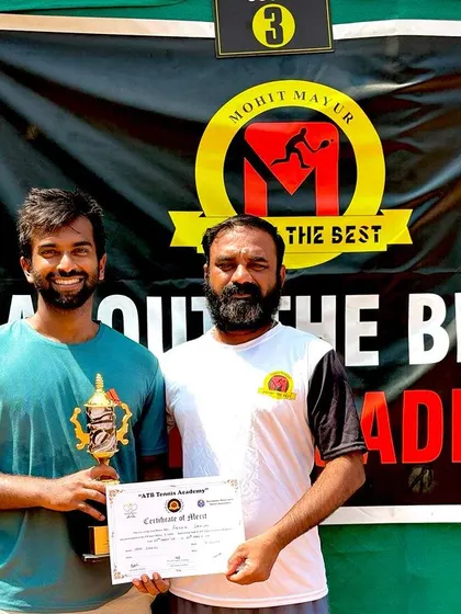 A doubles winner receiving his trophy at our AITA 1 Lakh tournament. We ensure our events are well organized and provide a great experience for all participants.