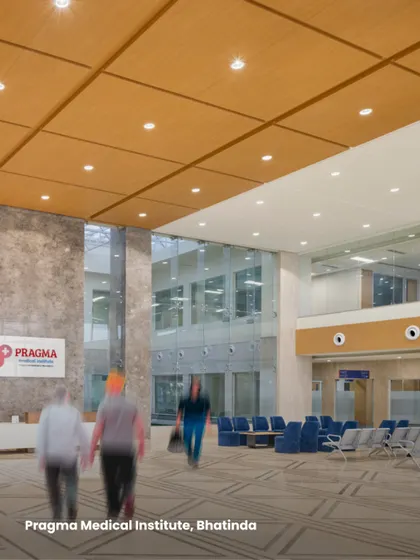The lobby at Pragma Medical Institute in Bhatinda showcases our use of high-quality, durable materials. The combination of marble flooring and wood-paneled ceilings creates a sophisticated and welcoming environment.