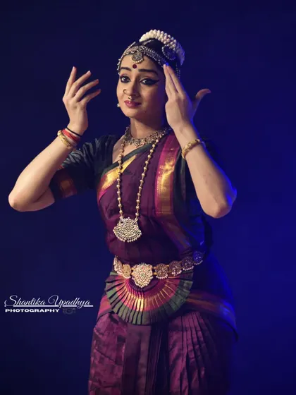 A close up shot capturing a soft, reflective expression. This moment portrays the Nayika reminiscing about her beloved.