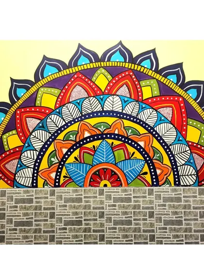 A close-up of the completed half-mandala mural. The vibrant colors and detailed patterns are designed to bring a sense of joy and tranquility to the space.