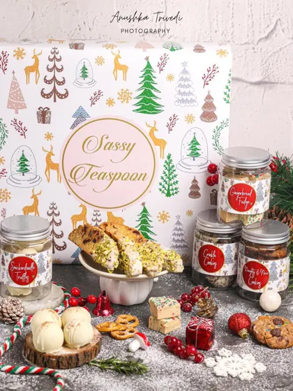A beautifully designed Christmas hamper from Sassy Teaspoon, showcasing their holiday collection of baked goods.