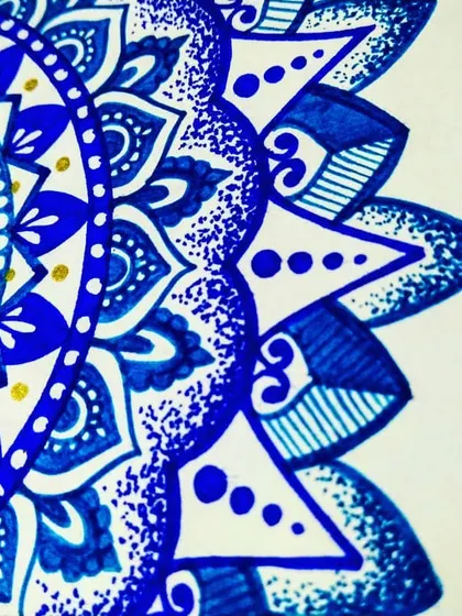 A close-up of a blue mandala scribble from my daily diary. Even quick doodles can be a form of meditation and creative expression.
