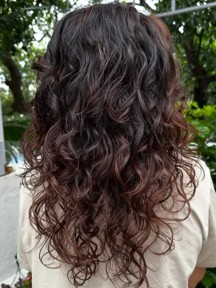Another view of the back, showing the consistent and healthy curl pattern from roots to ends.