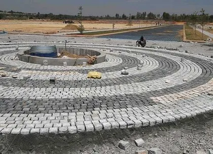 Another angle of the cobblestone circle during construction. This feature is designed to be the central point of the driveway or courtyard.