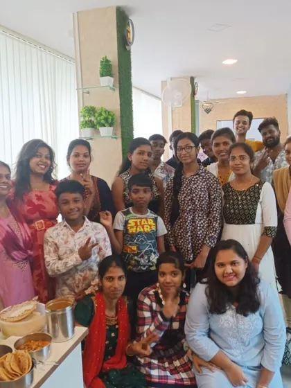 A happy group photo after a successful potluck event. Sharing food and stories is one of our favorite ways to bring everyone together.