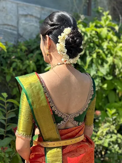 The back view of another client's blouse, this time a dark green one with a lovely criss-cross detail and embroidered border.