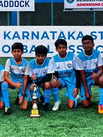 Our U13 team posing with their trophy after a successful tournament. This photo showcases the pride and accomplishment felt by our youth players.