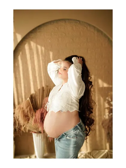 A relaxed and sun-kissed solo portrait in our boho studio, capturing a moment of pure bliss.