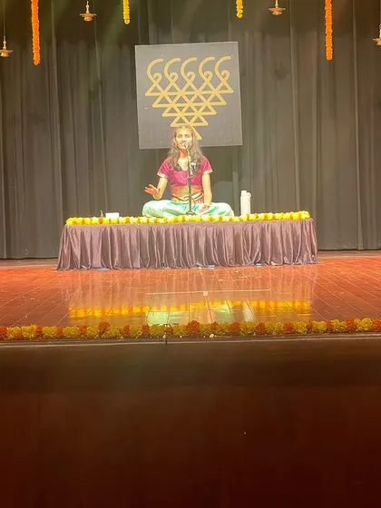 Seated on stage as the chief guest for Esha's Carnatic music arangetram. An arangetram is a student's debut performance, and it is a very special milestone to witness.