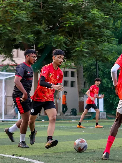 The team working together, moving the ball and creating space during a match.