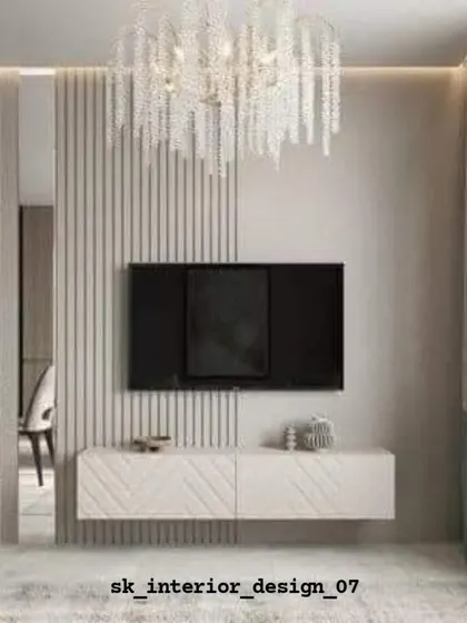 A chic TV unit with a chevron-patterned console and a beautiful crystal chandelier. The slatted partition on the side adds a layer of privacy and texture.