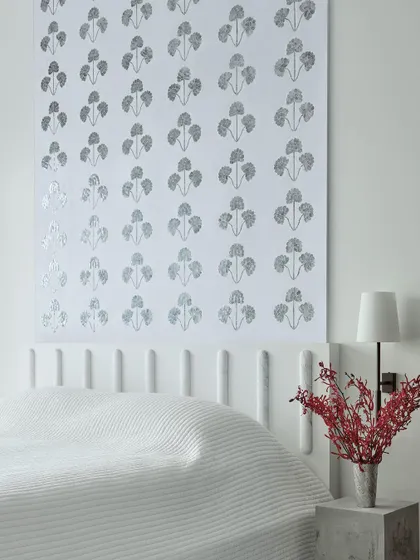 This guest bedroom features a custom back panel made by Thikri artisans from Udaipur. Thikri is a 400-year-old Rajasthani craft of inlaying hand-blown glass. It's these collaborations with local artisans that bring a unique soul and narrative to each home I design.