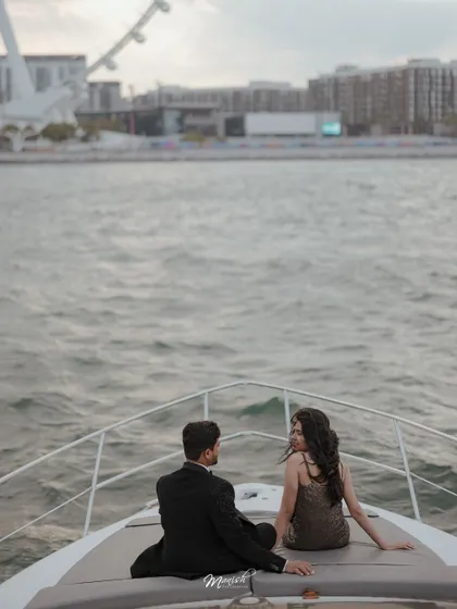 A serene moment on a yacht in Dubai, with the city's iconic skyline in the background. A perfect luxury destination pre-wedding shoot.
