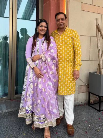 Posing with my father in the lilac floral suit. It's a versatile outfit that's perfect for family celebrations.