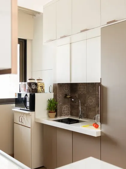 A compact and efficient kitchen corner in the same Mumbai home, with an appliance garage.