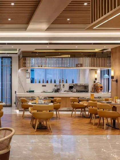 Additional views of the Radisson Resort, Khopoli, showcasing various interior and exterior details, from lobby seating areas and restaurant layouts to guest room configurations and architectural elements.