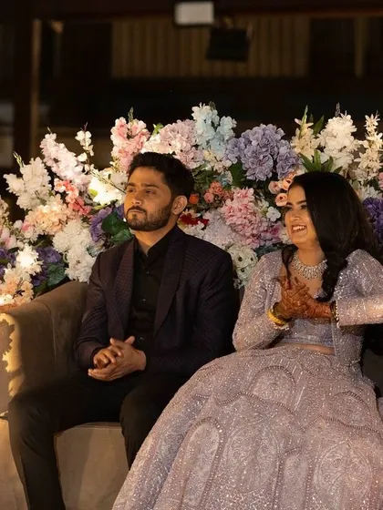 Another lovely shot of the couple. The bride's lavender lehenga is paired with a soft, glowing makeup look.