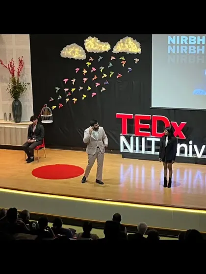 Engaging with volunteers on the TEDx stage during my talk on mentalism.