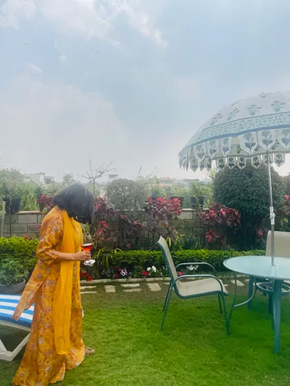 A lazy Sunday afternoon in spring. Here I am, enjoying a drink on my Vasant Vihar terrace garden, where the weather is just right for relaxing.
