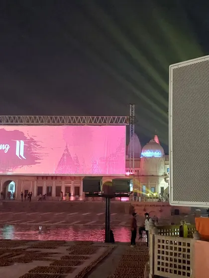 This shot highlights the strategic pairing of a large speaker array with the main LED screen. Placing powerful audio sources near key visual elements ensures a synchronized and impactful experience for the audience, even from a distance.