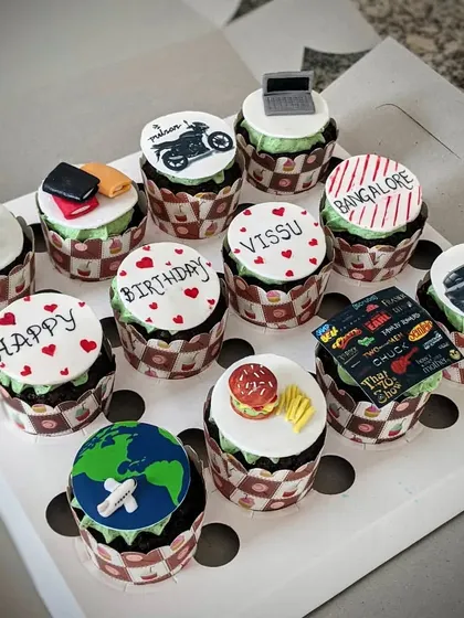 A full set of personalized chocolate cupcakes. Each one tells a part of the story, making them a perfect, unique gift for a birthday.