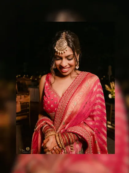 A beautiful portrait of the bride at her reception, her smile radiant and her outfit stunning.