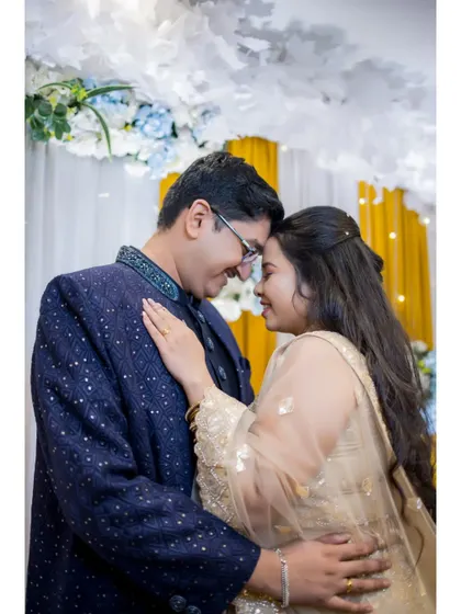 A romantic moment between the couple during their Sangeet night. The soft lighting and their close embrace create a beautiful, intimate portrait.