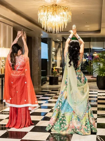A beautiful shot of the bride and her sister practicing their duet. These moments of dancing together create memories that last a lifetime.