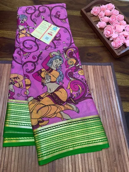 A printed Kalamkari Mysore silk saree with artistic dancing figures and a green border.