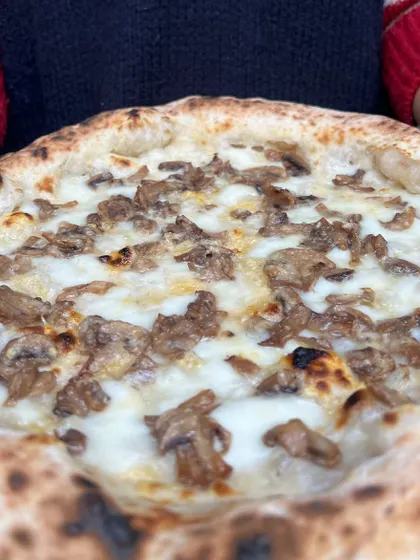A close-up of the Pizza Bianca, showing the delicious sautéed mushrooms.