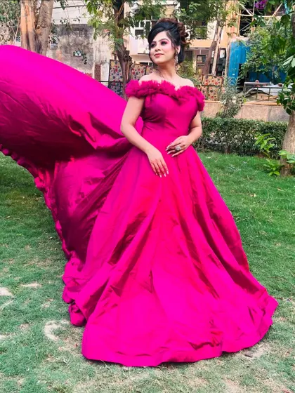 Another shot of the magenta trail gown, showing its impressive length and rich color.
