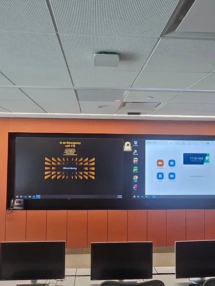 In this Mumbai training room, the orange wall panels and gridded ceiling tiles are both acoustic. They work together to ensure clear audio during presentations and prevent sound from disturbing the rest of the office.