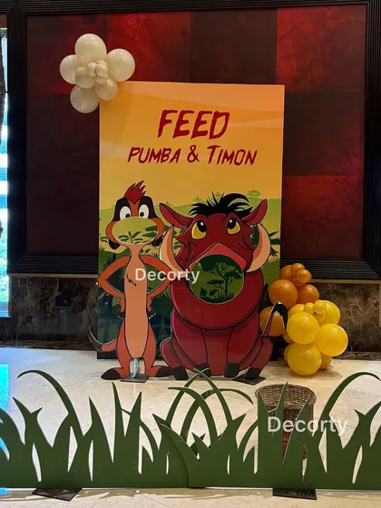 The 'Feed Pumba & Timon' game station, showing the fun design and setup.