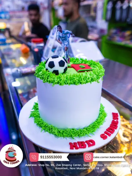 A simple yet effective football cake with a player, ball, and grassy frosting. Perfect for a quick and fun celebration for a football lover.