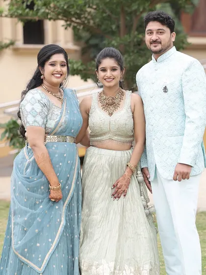 The bride and her sister with the groom. It's always fun to create looks for the whole family.