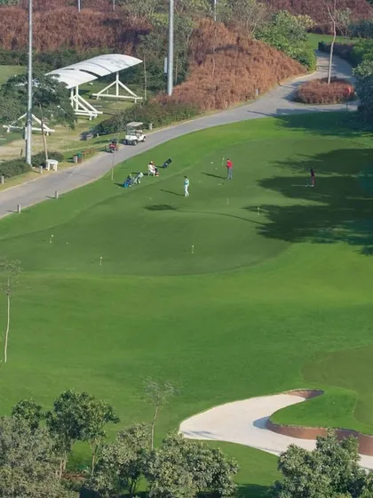 An aerial view of our pristine practice facilities, including the driving range and putting greens. We provide the perfect environment to learn, practice, and perfect every aspect of your game.