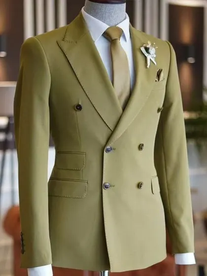 A double-breasted suit in a stylish olive green. This is a modern color for a classic silhouette.