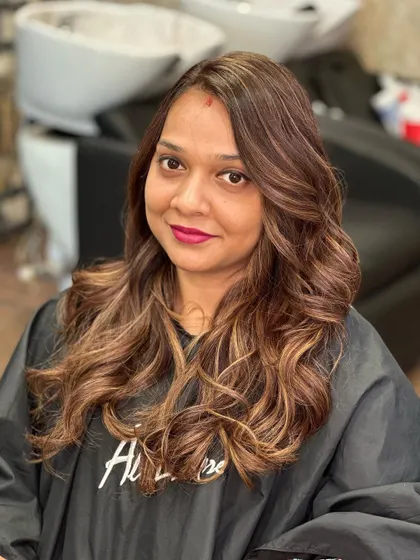 The after shot, a beautiful and happy client with her new caramel balayage.