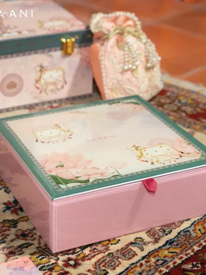 This pastel-hued gift box represents a fusion of modern elegance and timeless tradition. It is perfect for those who appreciate subtle luxury, blending heritage craftsmanship with a contemporary color palette for a sophisticated gifting experience.