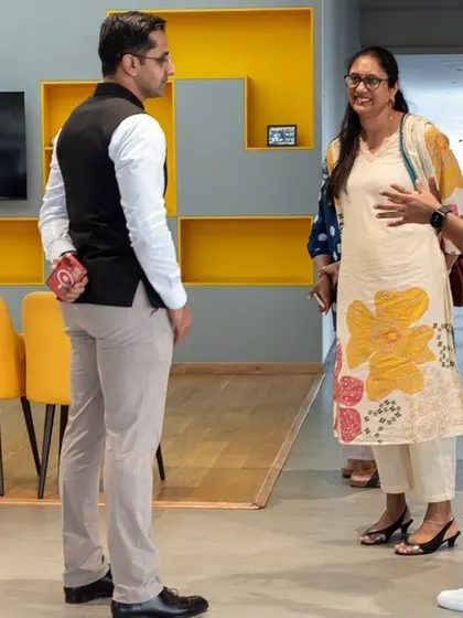Indian heptathlon queen Pramila Aiyappa in discussion with our team during her visit, sharing insights from her incredible athletic career.
