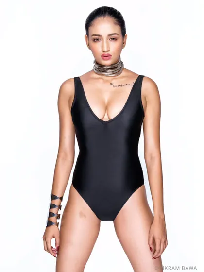 New kid on the block. For her first shoot of this style, Sweta rocked it. A powerful, direct-to-camera pose in a simple black swimsuit against a white backdrop.