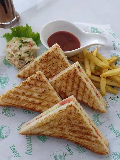 A close-up of our perfectly grilled sandwiches, a comforting and popular choice for any event.