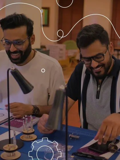 The joy of discovery is clear as two watch enthusiasts share a moment of insight during our workshop. It's a space to connect with fellow collectors and learn about the intricate world of timekeeping together.