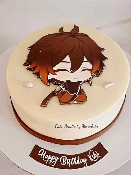 A simple and sweet Japanese anime themed cake. This no-fondant design features a cute character print, making it a great choice for a fan's birthday.