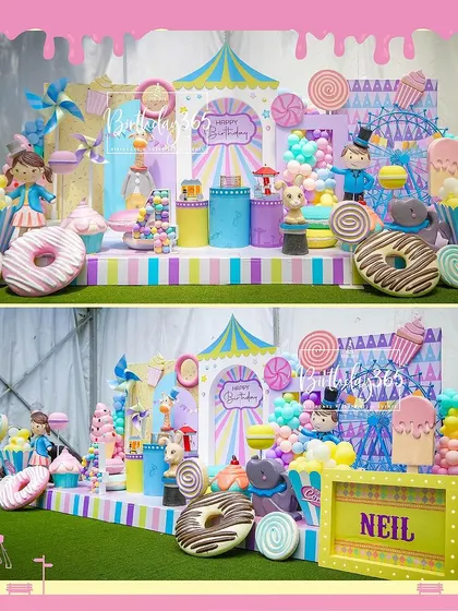 Welcome to a candy carnival! This vibrant setup for Neil and Naksh's party featured a full stage of sweet-themed props, including giant donuts, ice cream cones, a Ferris wheel, and a colorful circus tent backdrop.